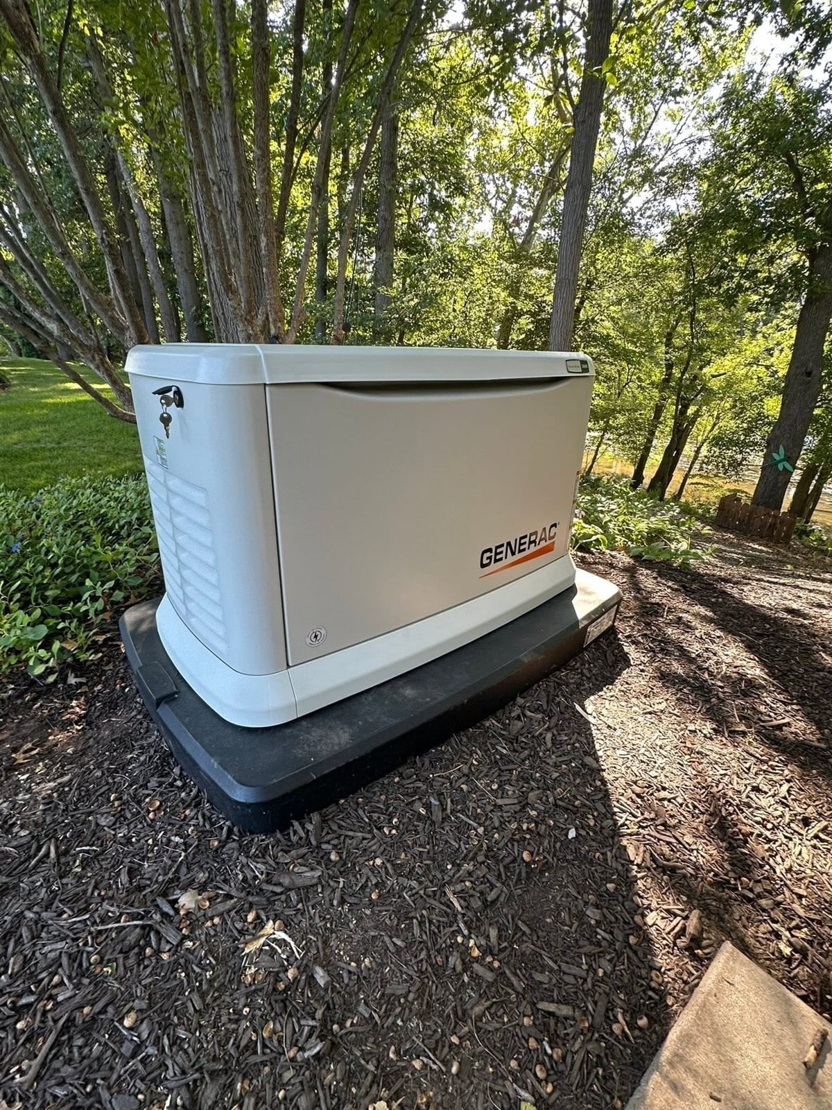 Generac generator installation near trees by Dynamix Electric